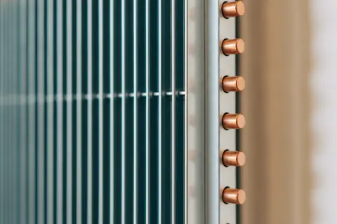 Close-up of clean AC coil fins with copper pipes